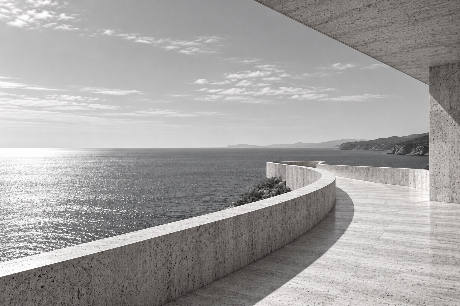 Curved architectural promenade overlooking the sea