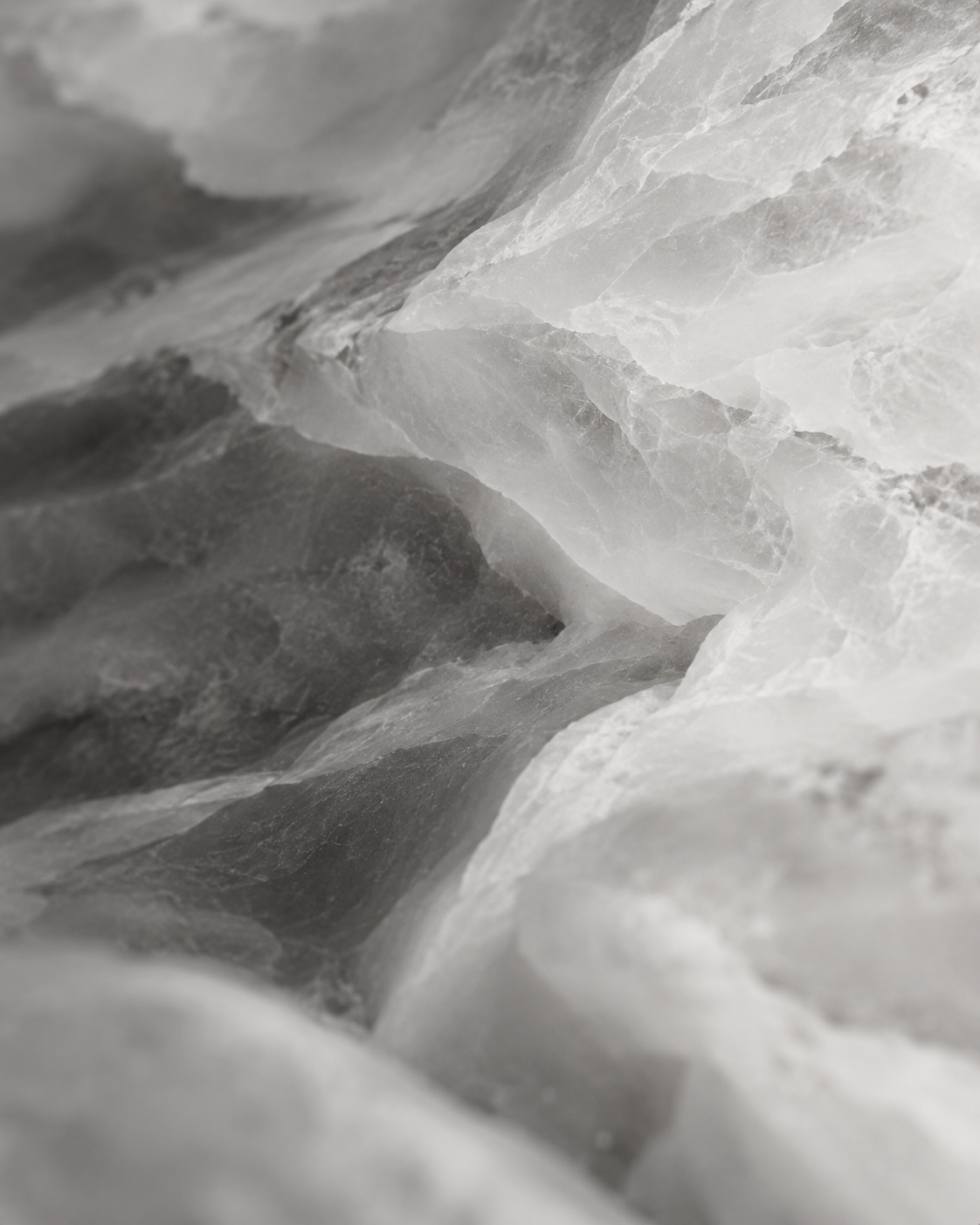 Abstract monochrome mineral textures and light