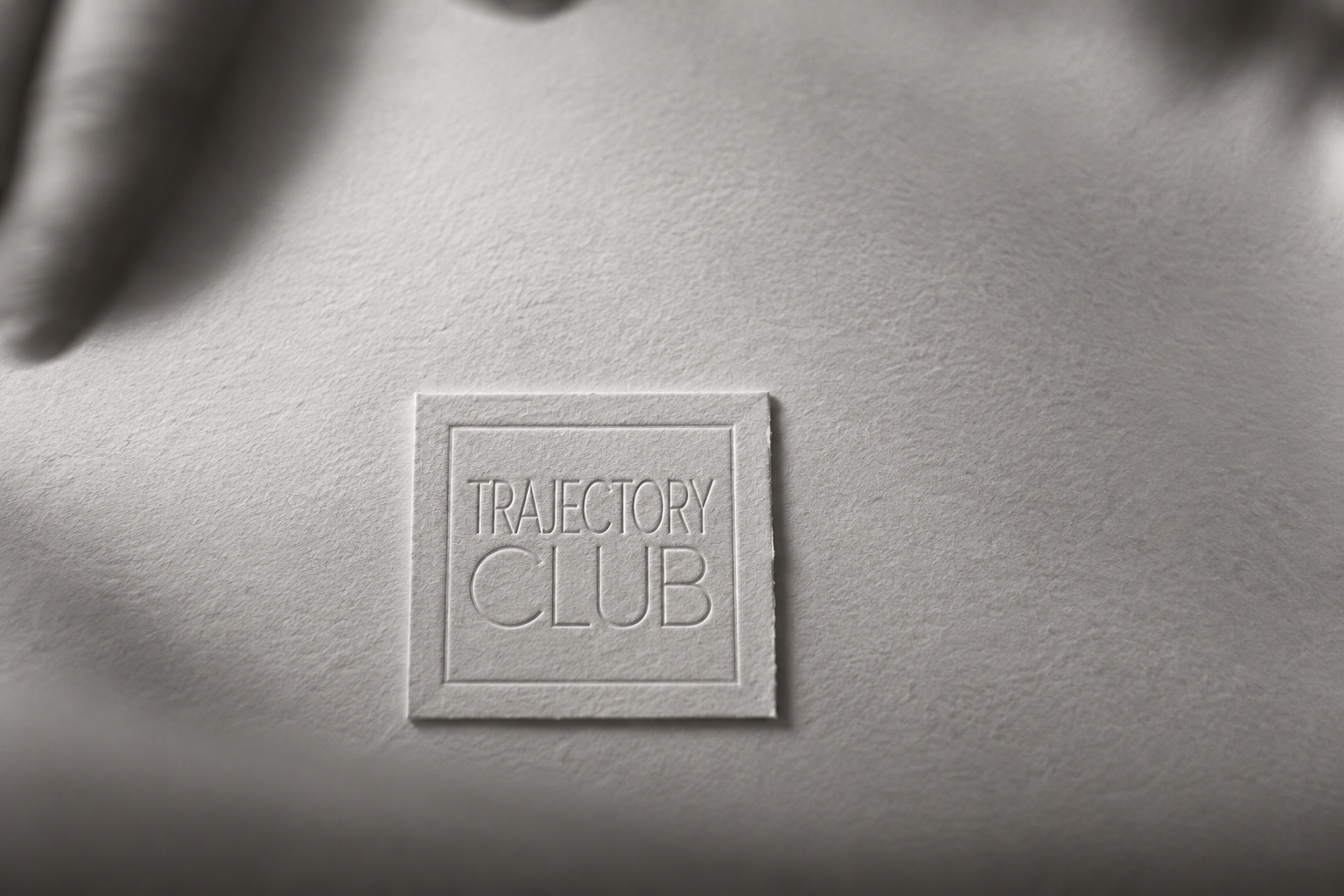 Trajectory Club embossed lettering on textured cotton card